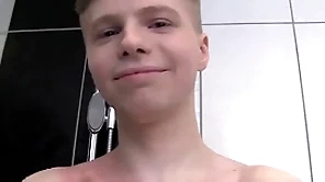 Cute saponaceous boy alone in a shower